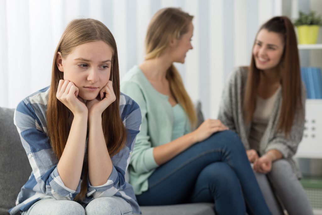 A child with Attention Deficit Hyperactivity Disorder sitting on a couch.